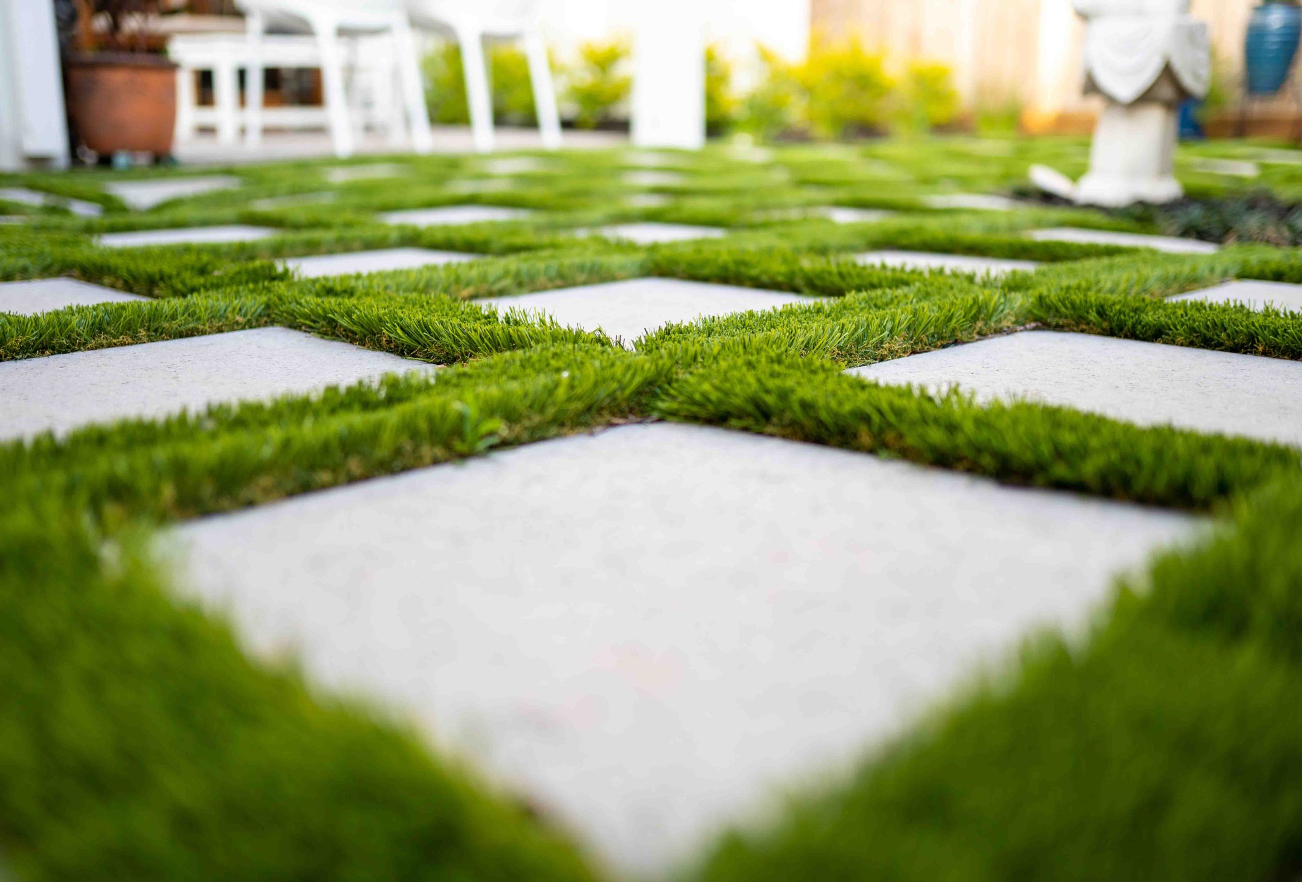 Astro,Turf,Between,Concrete,Pavers