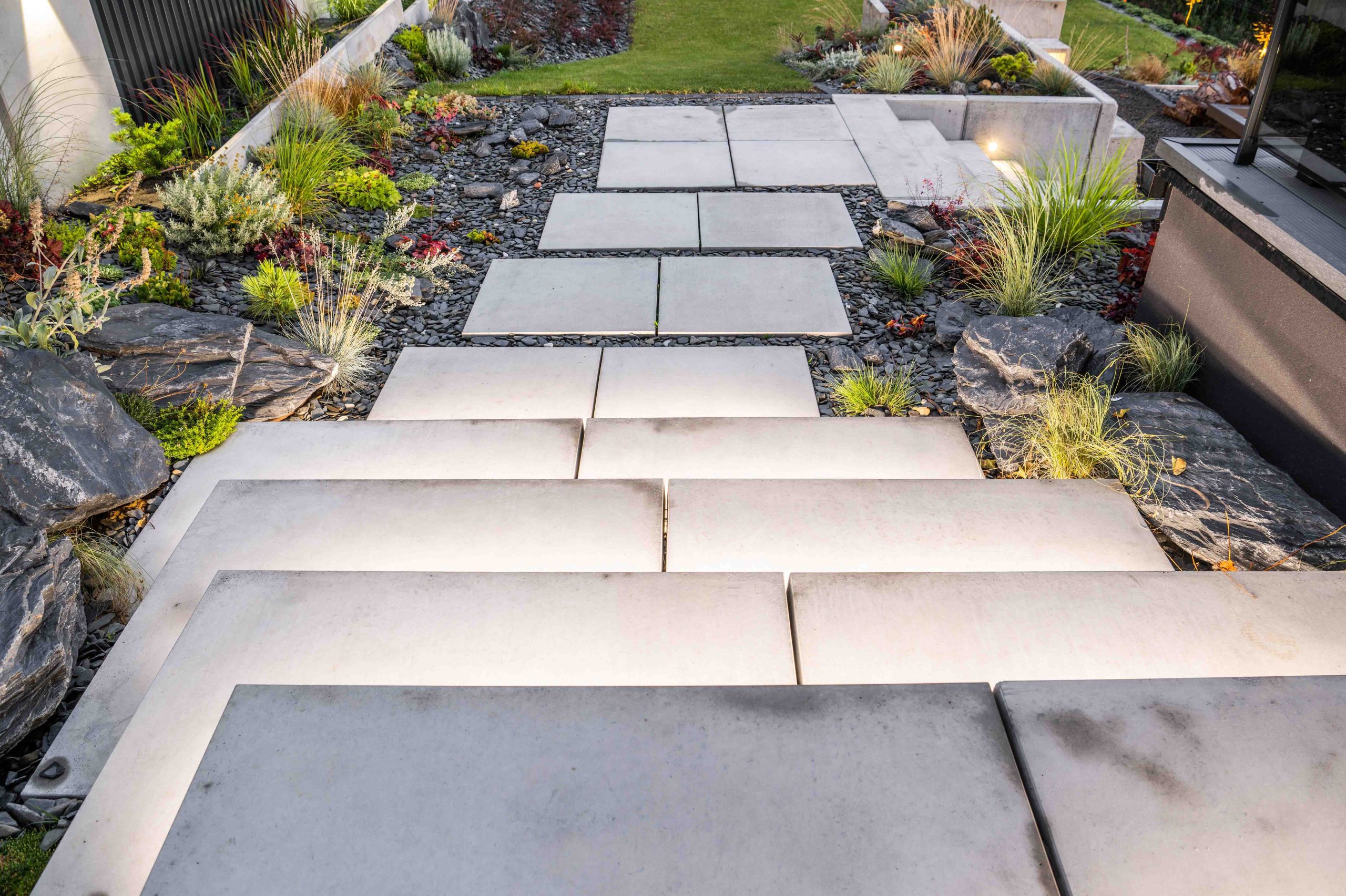 Modern,Residential,Backyard,Garden,With,Elegant,Large,Illuminated,Concrete,Stairs.