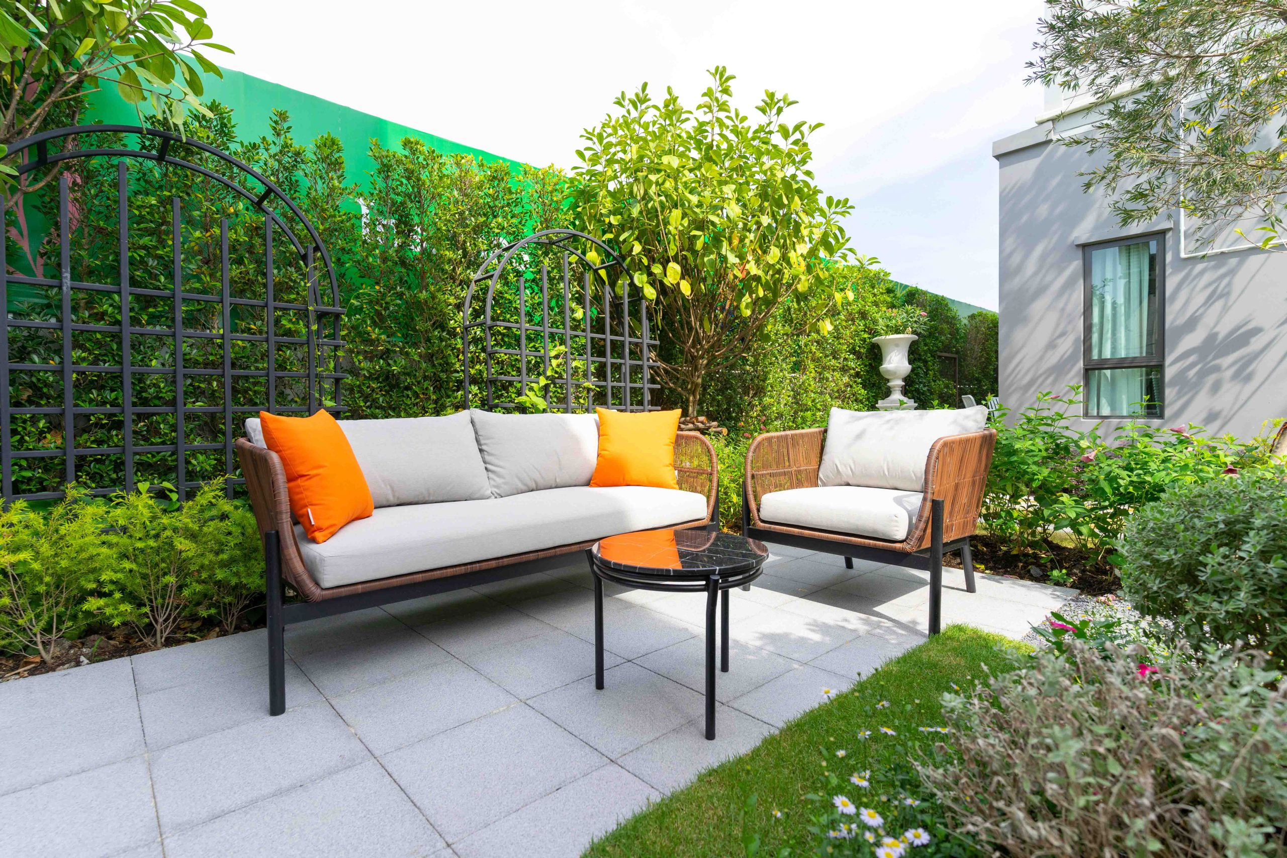 Patio.,Garden.,Outdoor,Living,Space,With,Couch,,Table,And,Pillow.